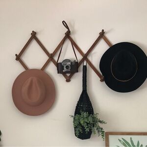 Vintage wooden accordion peg rack